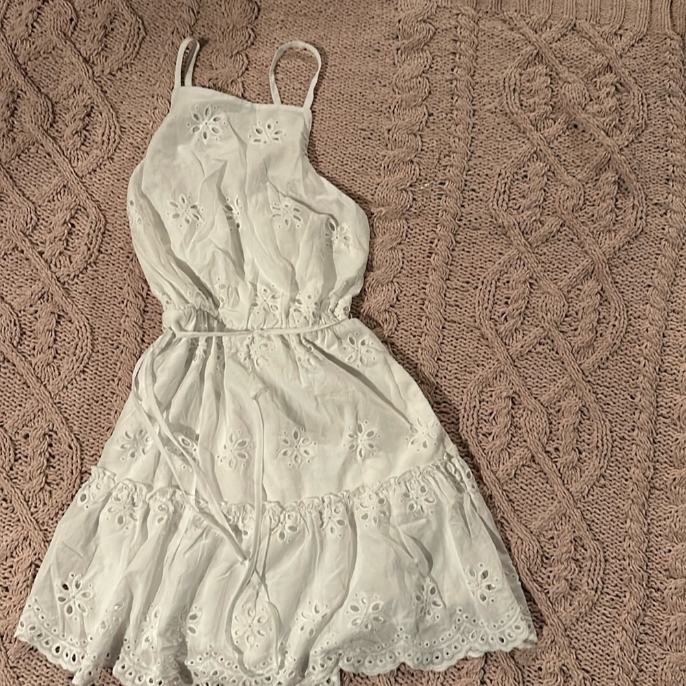 Girl’s white dress perfect for Easter with criss cross straps in back.